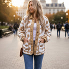 HONEY BLOSSOM SHERPA JACKET worn outdoors with a floral pattern and light beige color, perfect for layering and warm style.
