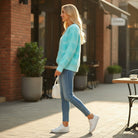LOVE AT FIRST SIGHT SWEATER in stylish blue pullover, paired with jeans and sneakers, perfect for cozy outings.