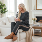 FELINE FAB PANTS SET featuring a model in cozy grey twisted rib fabric with leopard accents, perfect for lounging.