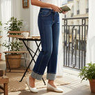 CHARLEIGH JEANS by Risen displayed on a model, showcasing a stylish mid-rise cuffed wide leg silhouette in a bright indoor setting.