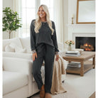 FELINE FAB PANTS SET showcasing a model in a cozy Carbon Grey twisted ribbed 2-piece pant set with leopard accents.