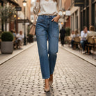 Model wearing ELLA-KATE BARREL JEANS by Risen, featuring mid-rise fit and wide barrel leg in a stylish urban setting.
