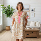 Model wearing BOARDWALK BELLE DRESS with a striking fashion print and relaxed fit, perfect for warm weather.
