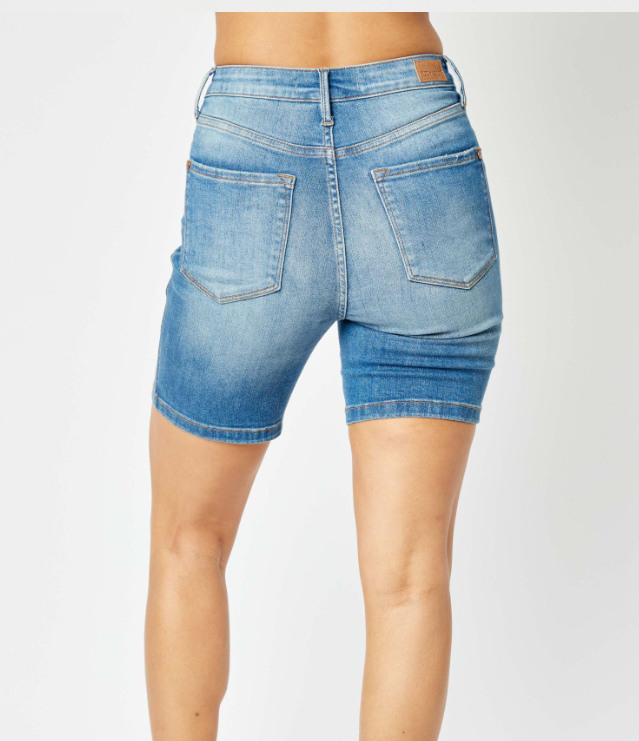Back view of Judy Blue Lola Tummy Control Bermuda Shorts in medium wash with high-waisted design.