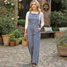 DENIM 4 DAYS OVERALLS - BIBI worn by a woman in a relaxed fit, styled for casual outdoor settings.