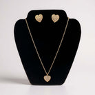 LOVE STORY Earrings and Necklace Set (gold) featuring heart-shaped design with sparkle on display.