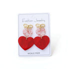 CHERISHED HEARTS EARRING featuring glossy red heart drops and a gold-tone bow, perfect for Valentine's Day and romantic wear.
