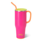 Bright pink 40oz Swig Life Tutti Frutti Mega Tumbler with a yellow lid and orange straw.