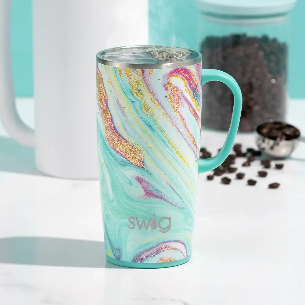 Vibrant 22oz Swig Wanderlust Tumbler with handle and swirled aqua and pink design.