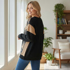 HOMETOWN HARMONY TOP - Heimish, showcasing a model wearing a cozy floral color block top in a stylish indoor setting.