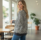 THE PERFECT SPOT Ribbed Top featuring a stylish model in snow leopard print, perfect for everyday wear.