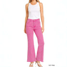 COLOR CRUSH DENIM - Zenana model wearing hot pink acid-washed wide leg jeans with frayed hem.